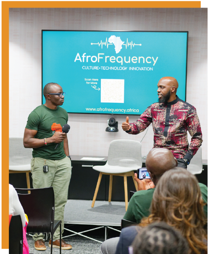 AfroFrequency speakers addressing an audience at an event